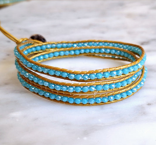Turquoise three wrap on gold leather
